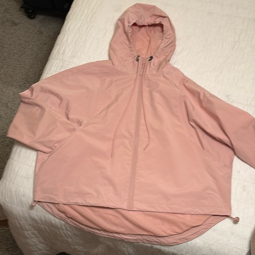 Women’s midsize pink raincoat never wore